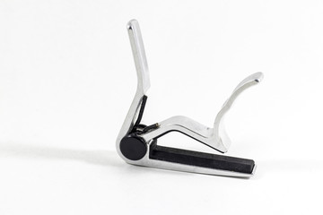 Clean shoot of metal reflective guitar capo