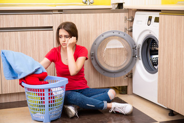 Woman doing laundry at home