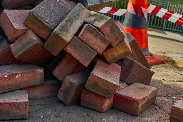 Road works, heap of red bricks