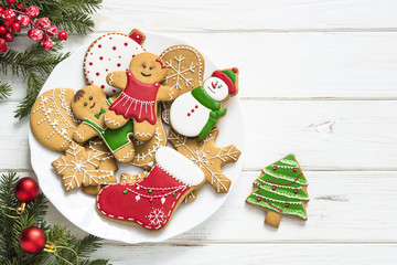 Christmas gingerbread in the plate on white. Top view.