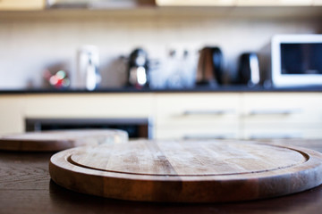 blurred rustic kitchen interior - focus on cutting board