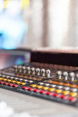 Mixing console of light equipment operator at the concert. Sound recording studio mixing desk with engineer or music producer