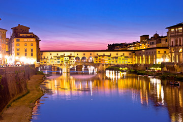 Fototapeta na wymiar Ponte Vecchio bridge and Arno river waterfront in Florence evening view