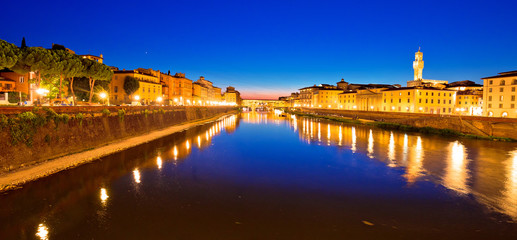 Naklejka na ściany i meble Ponte Vecchio bridge and Arno river waterfront in Florence evening view