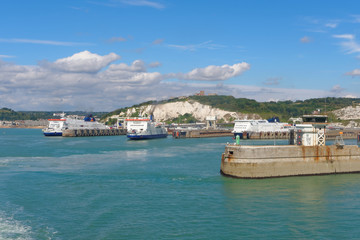 Three ferries at the port of Dover on a sunny day. - obrazy, fototapety, plakaty