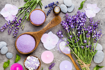 Fototapeta na wymiar Essential lavender salt with flowers top view.