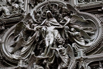 Ascension to the heaven of Jesus Christ at the door of Milan Cathedral, Italy