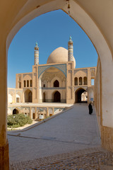 Fototapeta premium Muslim woman walking in Iran at Kashan Mosque