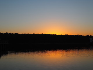 Sunset over lake, romantic landscape