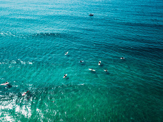 surfer waiting on beach for the next big wave in porto, portugal
