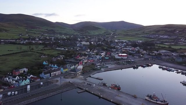 Morning Sunrise in Dingle, Ireland Filmed with 4k Aerial Drone. Small Colorful European Town Surrounded By Rich Green Landscape and Farmland.