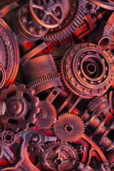 Steampunk background, machine parts, large gears and chains from machines and tractors.