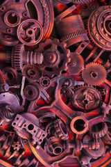 Steampunk background, machine parts, large gears and chains from machines and tractors.