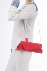 woman with red bag in her hands. on isolated background