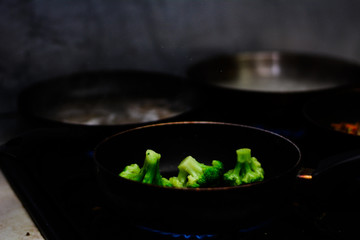cooking ovoci and meat in a skillet