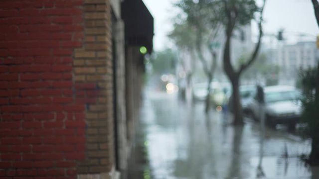 Background Plate of Rainy city street with a brick wall for green screen