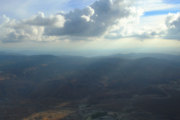 Fototapeta premium Aerial Clouds over Mountain Range Landscape