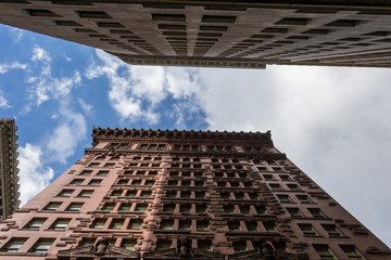 Looking up at classic skyscrapers