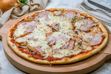Pizza with ham and mushrooms
