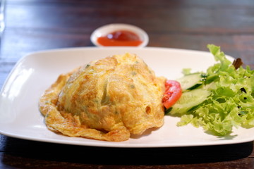 fried egg omelette on wooden background