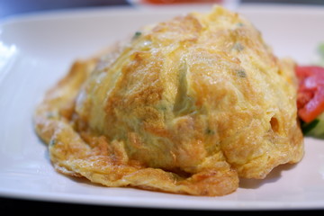 fried egg omelette on wooden background