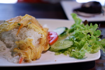fried egg omelette on wooden background