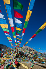 Tibetan prayer flags on blue sky