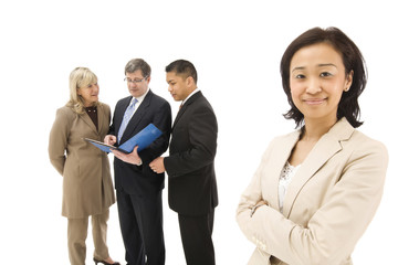 businesswoman with her colleagues in background