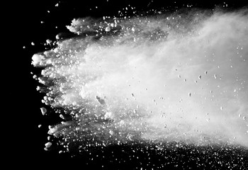 White powder explosion on black background. 