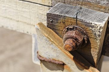 rusty screw and nut on beach