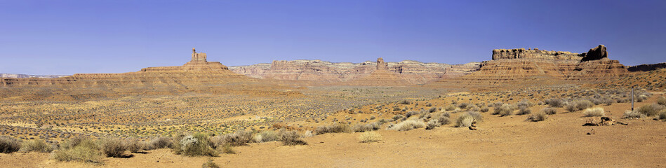 Panoramic view of a desert in Utah on blue sky as background.