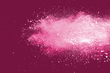 powder explosion on red background.