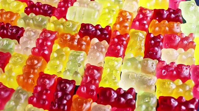 Gummy bear background. Gummy bears as texture. Gum bear candy colorful pattern.