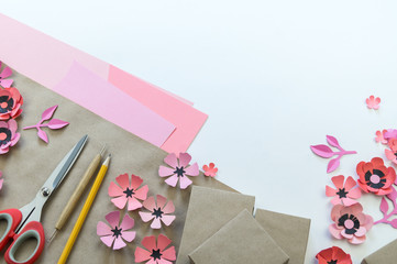 Packing a festive box with ribbons and flowers