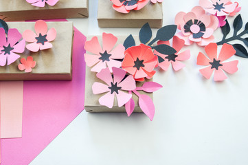 Packing a festive box with ribbons and flowers