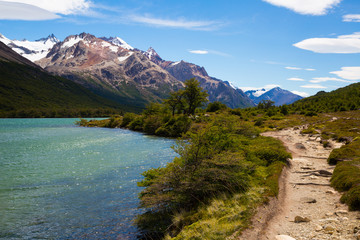 River in valley at foot of Andes mountains