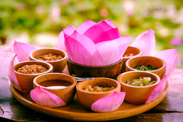 pink leaf of lotus  wrapped in a word with dried lemon, coconut, roasted ginger onion,chili, fresh beans and nectar made from shrimp paste. Delicious and useful.