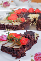 Delicious homemade brownie cake with strawberries. Selective focus