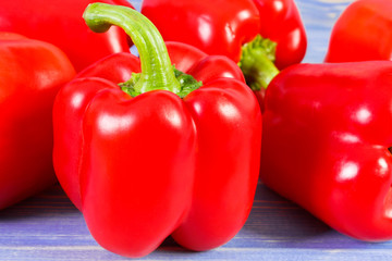 Red peppers on purple boards, healthy nutrition