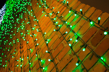 Green Christmas Lights On Red Brick Wall
