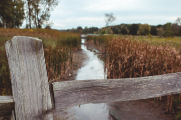 Fence by Small Stream in the Fall