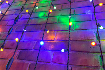 Multi Colored Christmas Light On Brick Wall