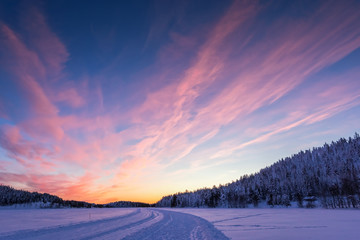 Background with beautiful pink sunset in Lapland
