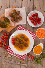 Meatballs with mashed carrots.