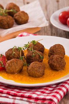 Meatballs with mashed carrots.