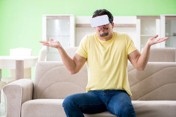 Young man with virtual reality goggles