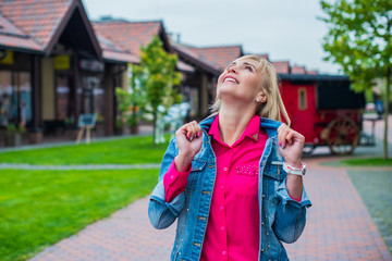 Fototapeta premium Mature lady rest, people concept - Nice beautiful woman in autumn time. Pretty woman traveler and relax. Enjoying at day, adventure stylish vacations outdoor 
