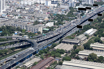 Aerial view of highway and modern buildings in Bangkok