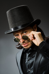 Vintage concept with man wearing black top hat