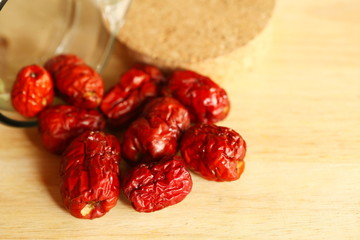 Dry jujube on wood cut plate scene.